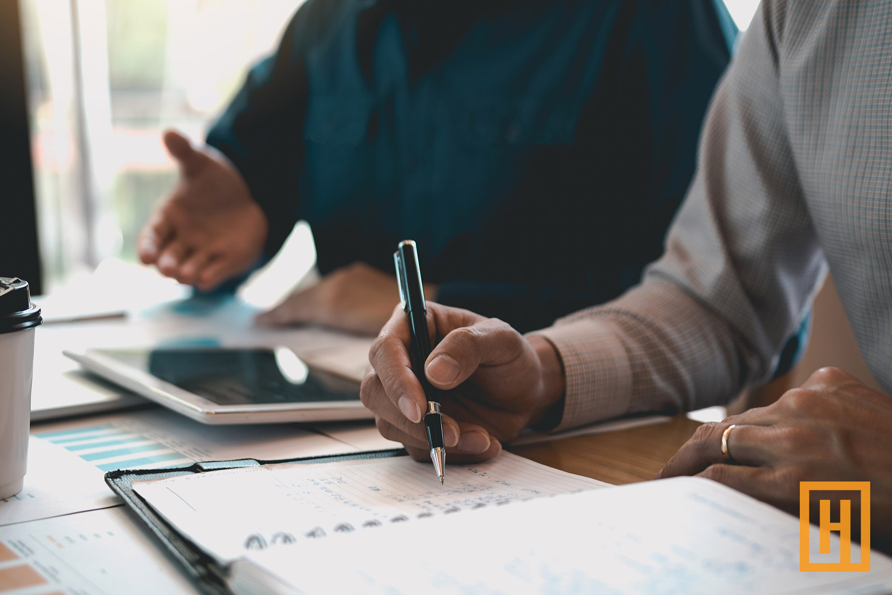 financial investors reviewing charts and data